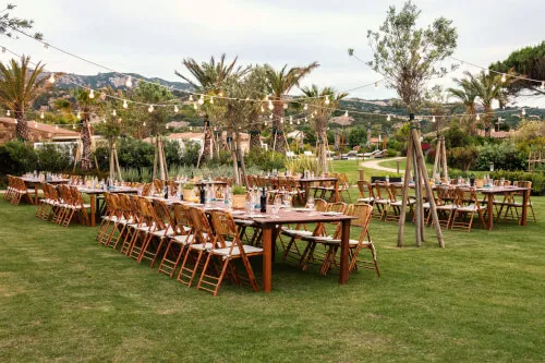 Elegant outdoor party setup with long tables at 7Pines Hotels & Resorts