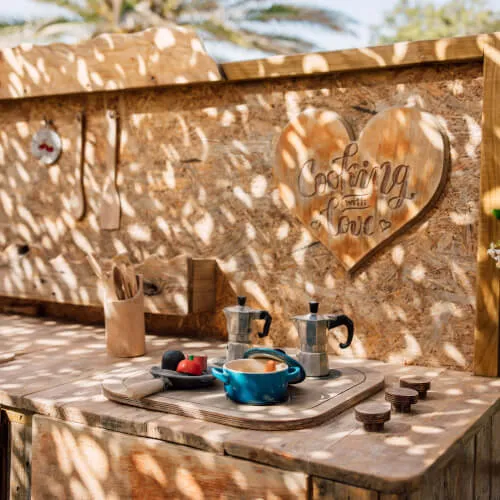 Wooden table with kettle at 7Pines Hotels & Resorts