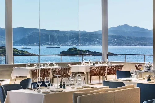 Elegant dining at 7Pines Resort's Capogiro with sea views, Sardinian cuisine, and fine wines.